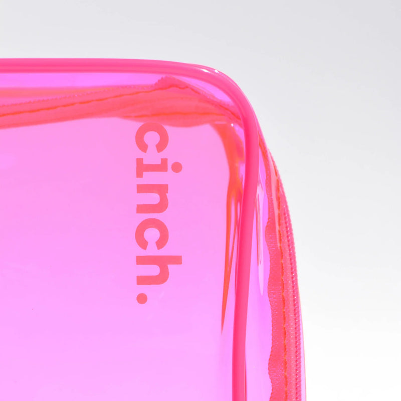 Up close shot of Cinch Skin Neon Pink PVC Minimalist bag with the logo of Cinch being shown on the corner of the bag