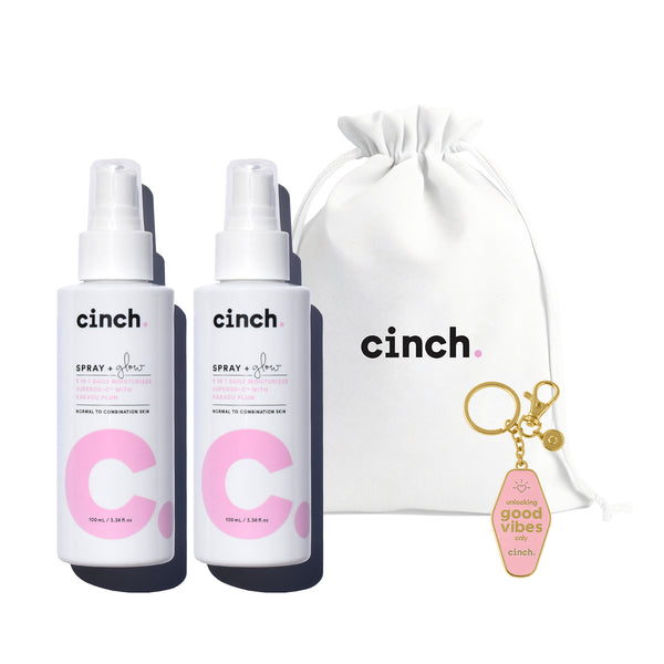 Limited edition Spray + Glow skincare bundle featuring two full-size hydrating facial mists, a white cotton Cinch logo bag, and a 'Good Vibes' key ring—perfect for gifting or glowing up your own skincare routine.