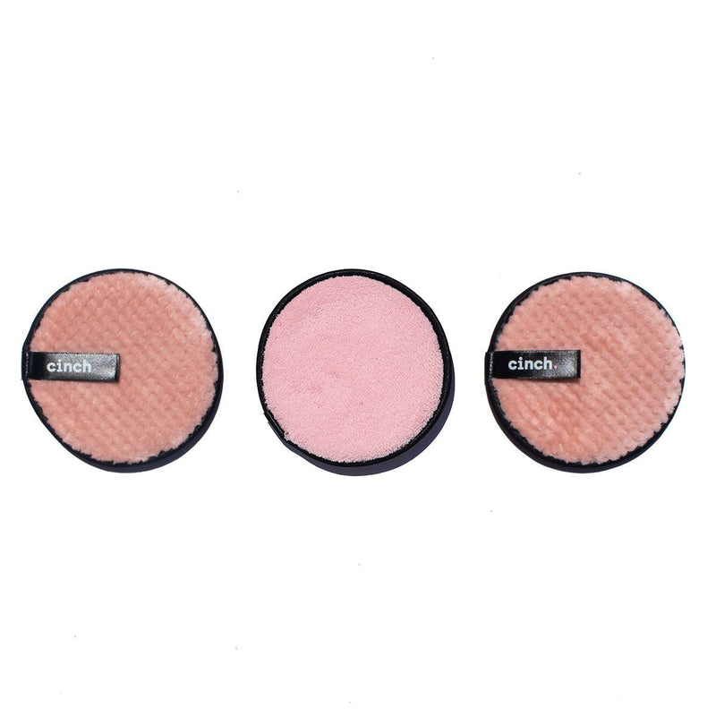 Three pink Wipe + Glow reusable face pads, double-sided for gentle daily cleansing, makeup removal, and light exfoliation.