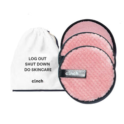 Set of 3 pink Wipe + Glow reusable face pads with wash cloth, double-sided for gentle makeup removal and exfoliation, ideal for daily cleansing routines.